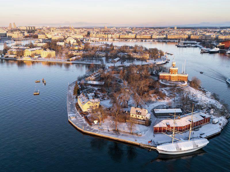 Stockholm in winter from the air, the red Kastellet tower on Kastellholmen above the harbour