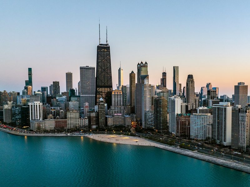 Chicago's lakefront skyline at dusk, seen from over Lake Michigan
